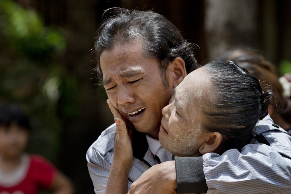 Former slave fisherman Myint Naing and his mother, Khin Than, cry as they are reunited after 22 years apart. Myint, 40, was among hundreds of slaves who returned to Myanmar following an investigation into the use of forced labour in southeast Asia’s seafood industry. Photo: AP