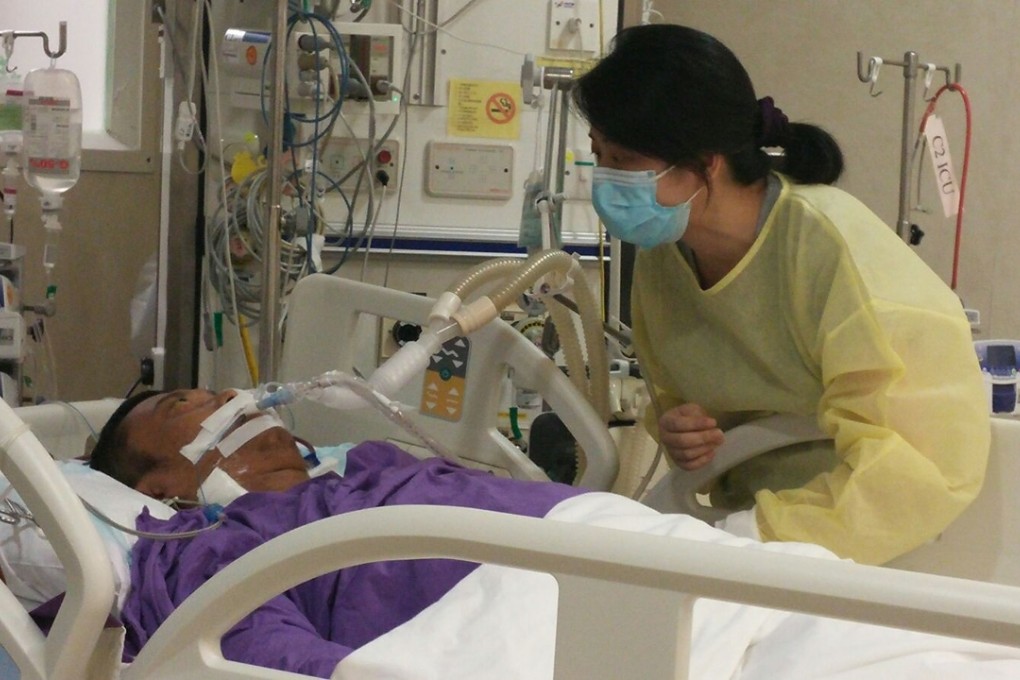 Stephen Lee’s wife visits him in hospital last August. Photo: SCMP Pictures