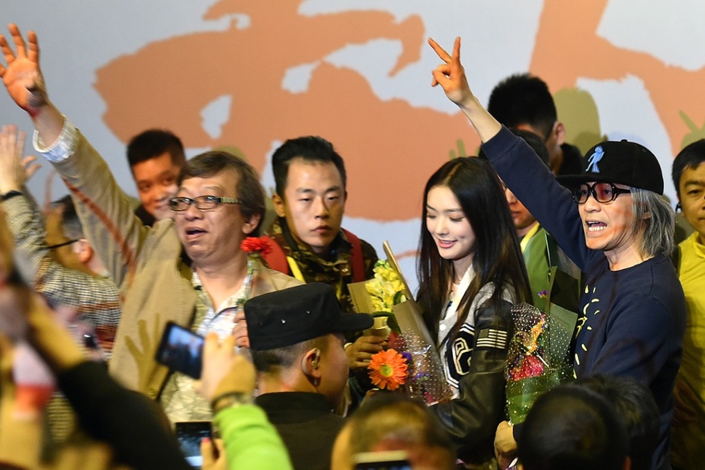 Director Stephen Chow gestures to fan in Taiyuan, Shanxi province. Photo: Xinhua