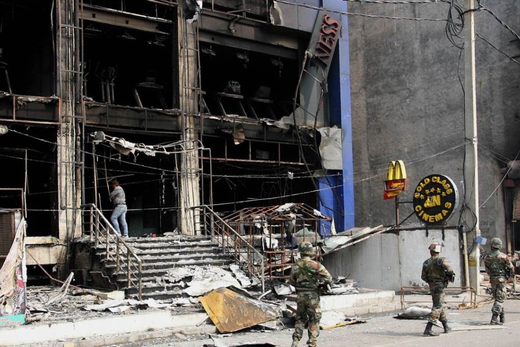Indian soldiers patrol Rohtak after widespread rioting. Photo: AF