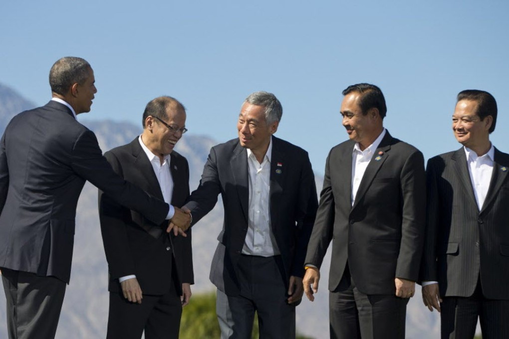 President Barack Obama (left) shakes hands with Singapore Prime Minister Lee Hsien Loong (centre) after a group photo at the Asean summit at Sunnylands in Rancho Mirage, California. Photo: AP