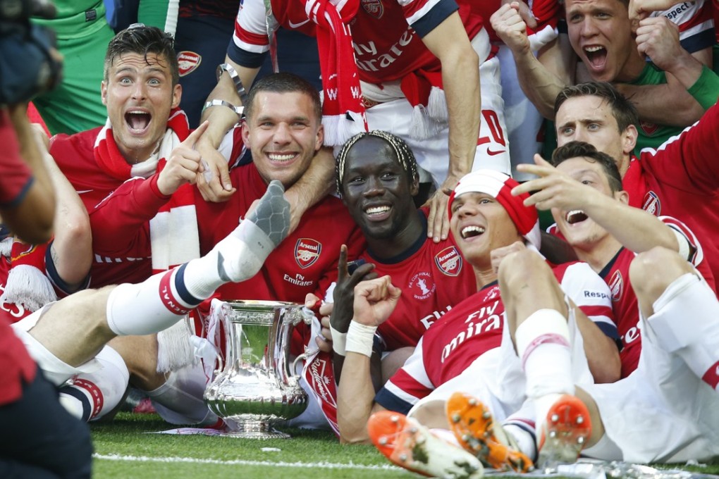 Arsenal celebrate in 2014. Photo: Xinhua