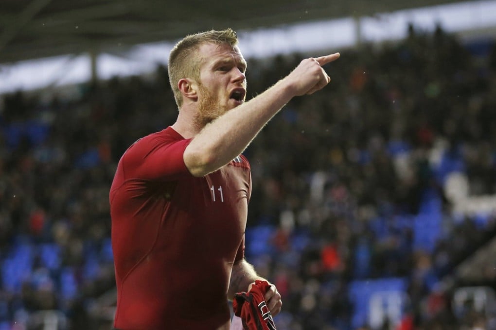 West Brom's Chris Brunt reacts after a coin is thrown at him from the crowd. Photo: Reuters