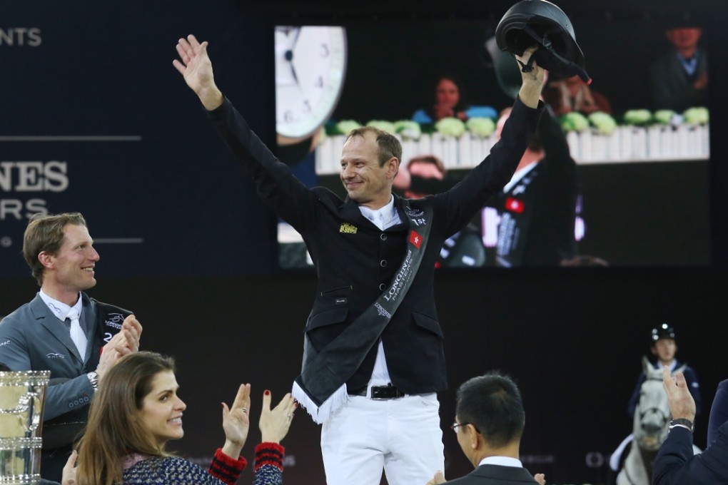 Marco Kutscher celebrates his win in the Longines Grand Prix at AsiaWorld-Expo in Hong Kong. Photo: Nora Tam