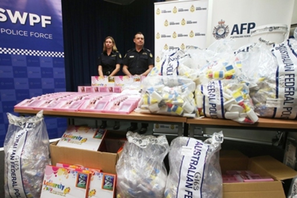 Officers stand by a display of confiscated drugs in Sydney. Photo: AP