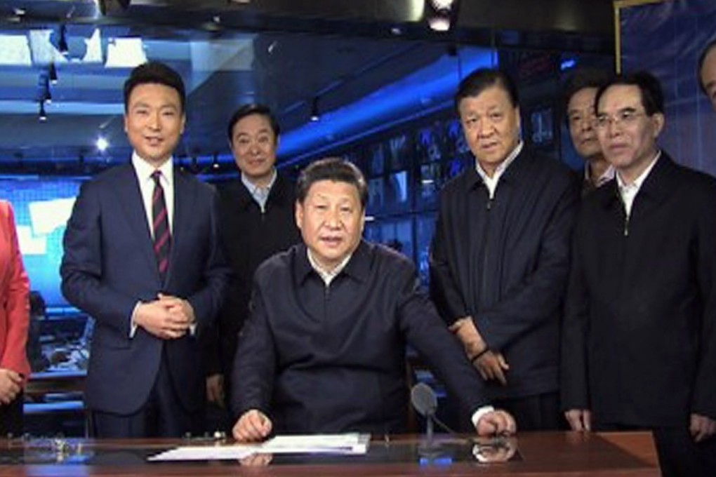 President Xi Jinping sits in the presenter’s chair of Xinwen Lianbo, the 7pm prime-time news programme, surrounded by two hosts and other officials in the CCTV studio. Photo: Simon Song