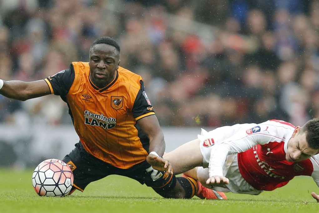Hull’s Adama Diomande (left) and Arsenal's Laurent Koscielny hit the turf after a tangle during their FA Cup fifth-round match at the Emirates stadium in London. Photo: AP