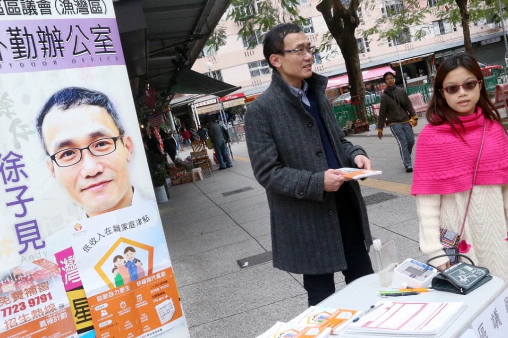 Eastern District councillor Chui Chi-kin works at his mobile office on the Yue Wan Estate in Chai Wan. Photo: David Wong