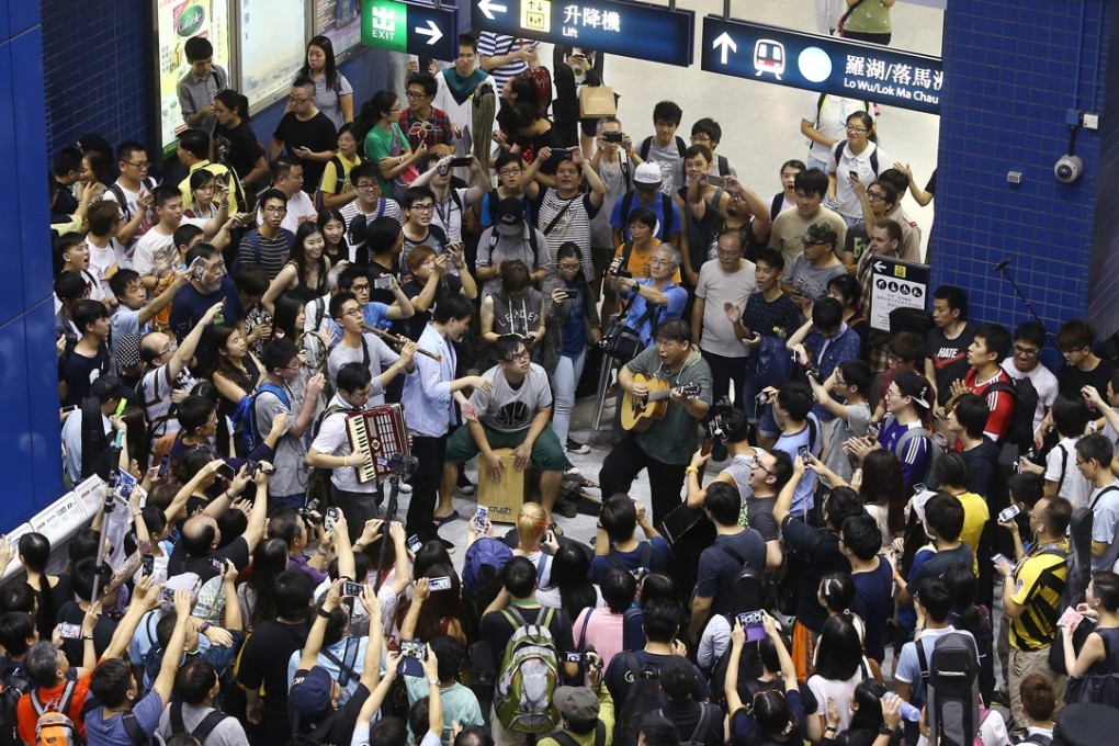 Musicians stage a protest about the carriage of musical instruments at Tai Wai MTR station in October. Photo: Sam Tsang