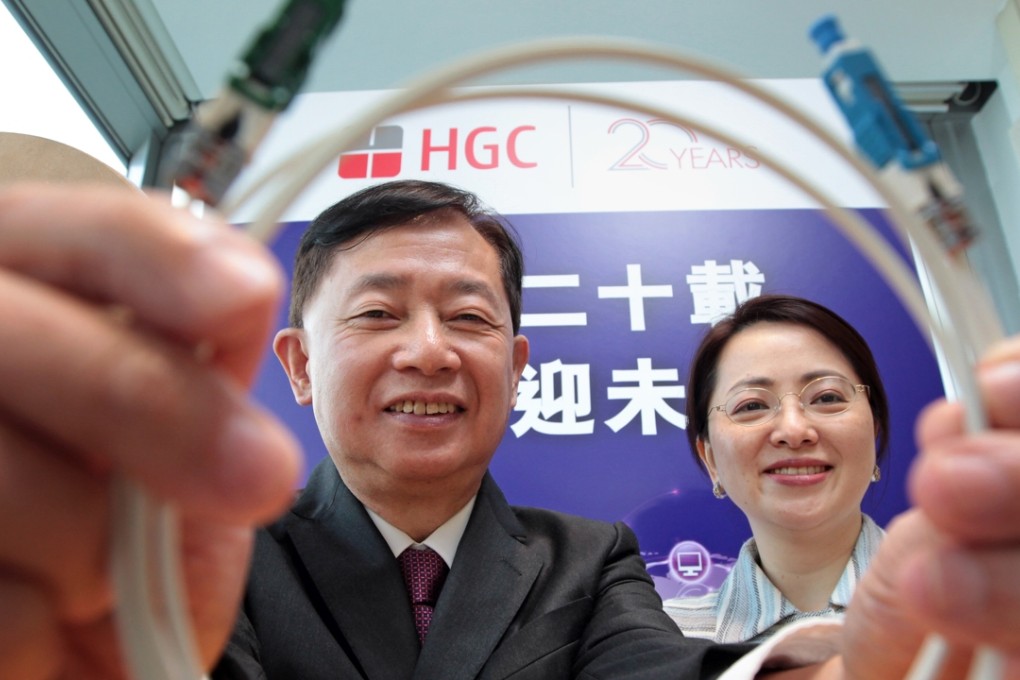 Chief executive Peter Wong King-fai and Jennifer Tan Yuen-chun, COO of Hutchison Telecom, pose for a photograph in Tsing Yi, hong Kong last November. Photo: Bruce Yan