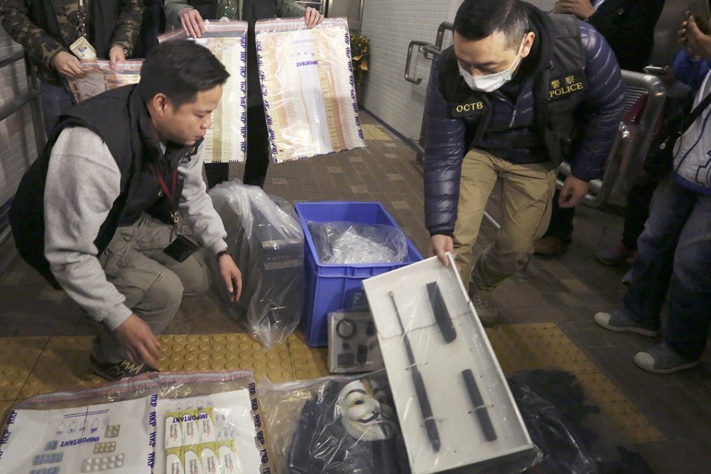 Police exhibit some of the items including an extendable baton, chemicals and HK$530,000 in cash seized during yesterday’s raid at a flat in Tin Shui Wai. Photo: Nora Tam