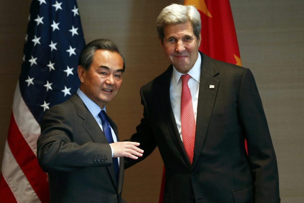 China's Foreign Minister Wang Yi (left) will hold talks with US Secretary of State John Kerry (right) during his US visit File photo: Reuters