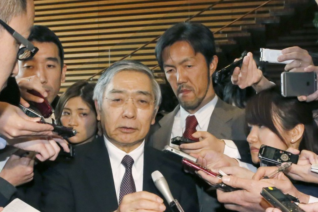 Bank of Japan Governor Haruhiko Kuroda speaks to reporters at the prime minister's office in Tokyo on February 12. Photo: Kyodo