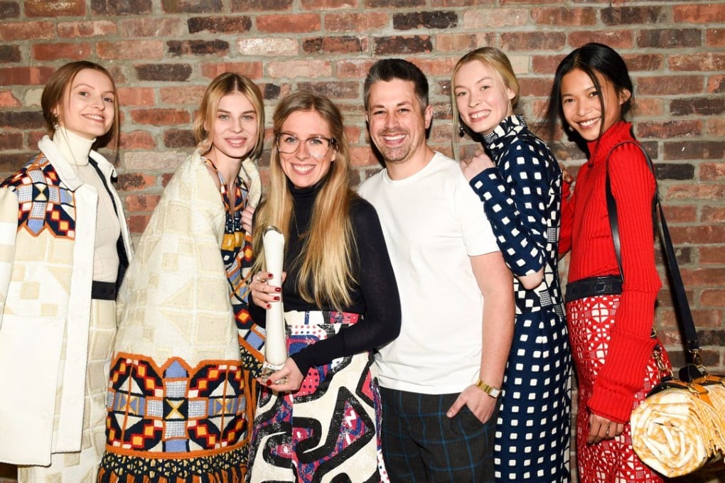 Catherine Teatum (second left) and Rob Jones who won the 2015-16 International Woolmark Prize for womenswear, in New York.