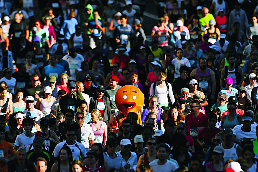 A participant dressed as a gingerbread man races in the annual ‘City 2 Surf Fun Run’ in Sydney. The uphill battle for young aspiring home owners is most apparent in Sydney where the median home costs 12.2 times the median annual pretax household income. Photo: Reuters