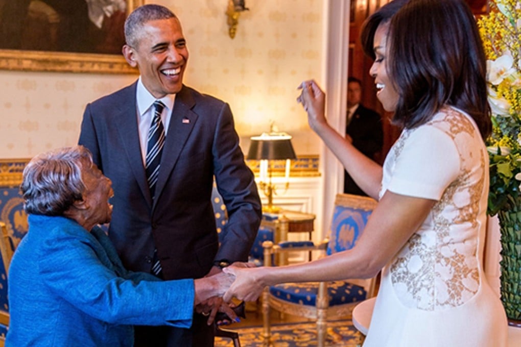 Virgina McLaurin could not contain here excitement upon meeting US President Barack Obama and Fist Lady Michelle Obama at the White House last week. Photo: White House