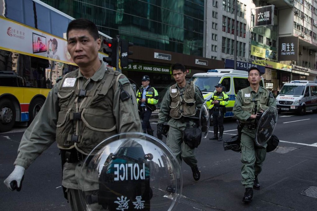 Police donning riot gear in Mong Kok in February underscores the preponderance towards social protest in a climate of fewer opportunities to get ahead. Photo: AFP