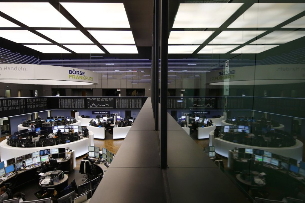 The trading room of Frankfurt's stock exchange is reflected in the window of the visitor's gallery. Photo: Reuters