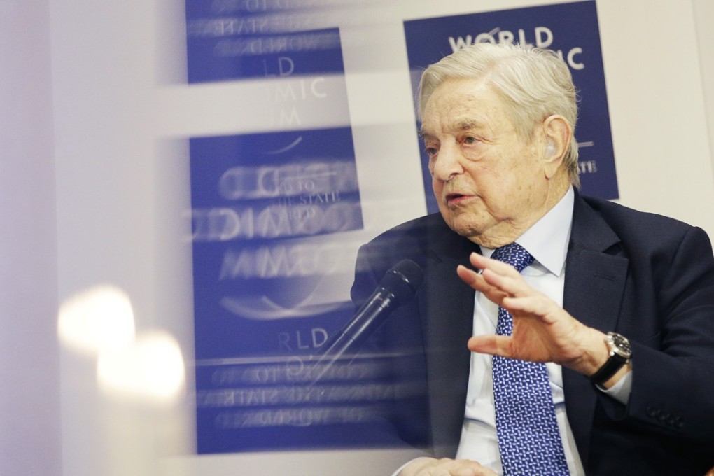 George Soros, billionaire and founder of Soros Fund Management LLC, gestures as he speaks during an interview at the World Economic Forum (WEF)in Davos, Switzerland on January 21. Photo: Bloomberg