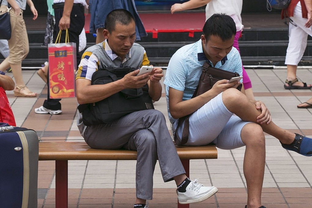 Smartphone users in Beijing. Guangdong’s tourism authorities said the social media campaign had many followers in Europe and countries along the “Maritime Silk Road”. Photo: EPA