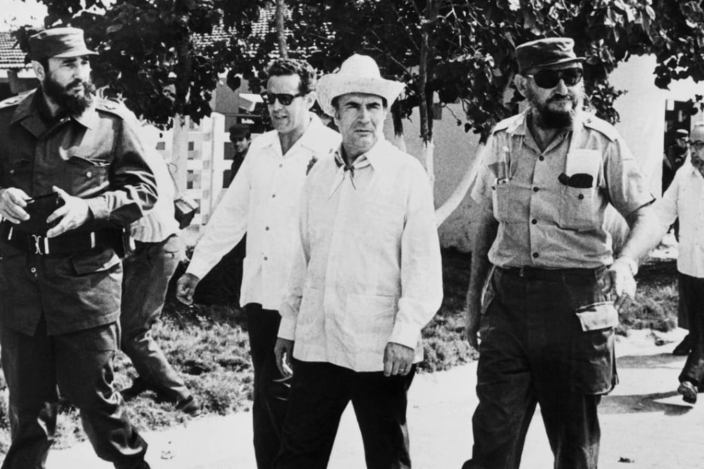 Fidel Castro (left), Ramon Castro (right) and future French president François Mitterrand (centre) stroll through Havana on December 14, 1974. Photo: AFP