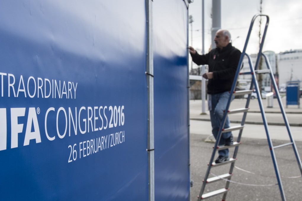 A man works on a fence for the extraordinary Fifa Congress being held in Zurich. Photo: AP