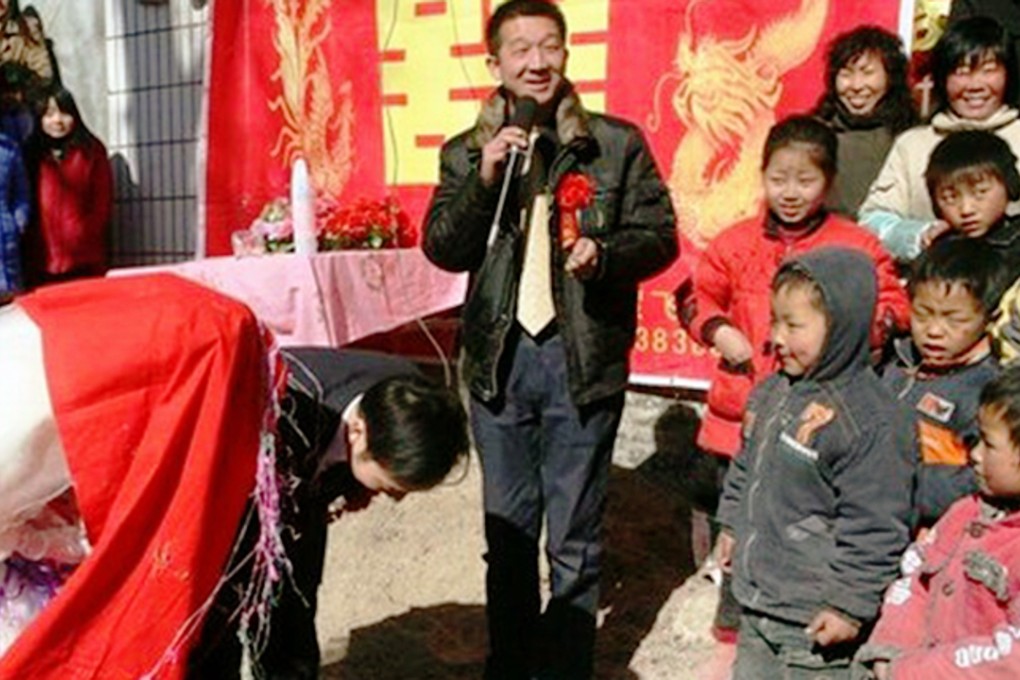 A man hosts a wedding ceremony in a rural community in China as the bride and groom bow to their guests. Photo: SCMP Pictures