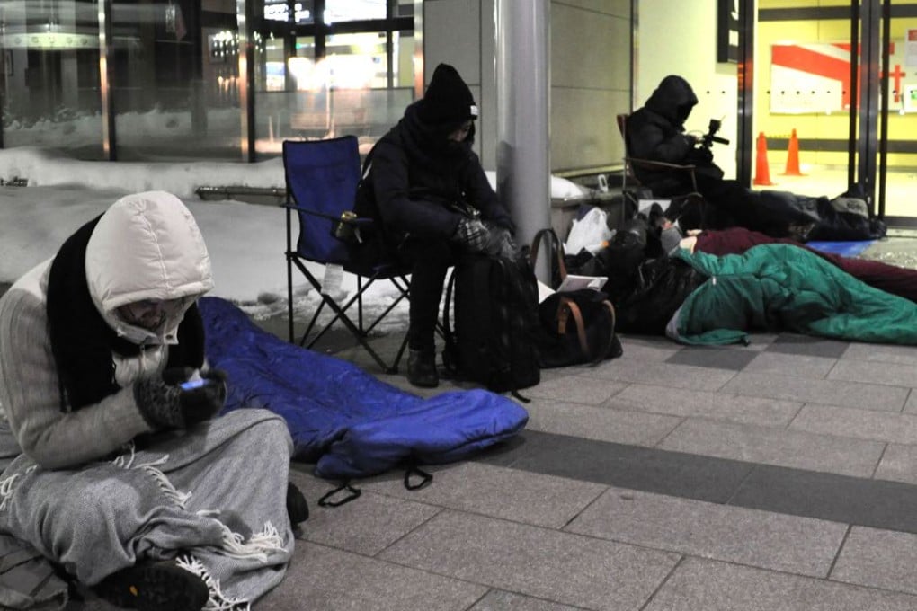 People line up outside JR Sapporo Station in Hokkaido Prefecture, northern Japan to purchase tickets for the Hokkaido Shinkansen bullet train for March 26, the day the new service is launched connecting Hokkaido and Tokyo in four hours and two minutes. Photo: Kyodo
