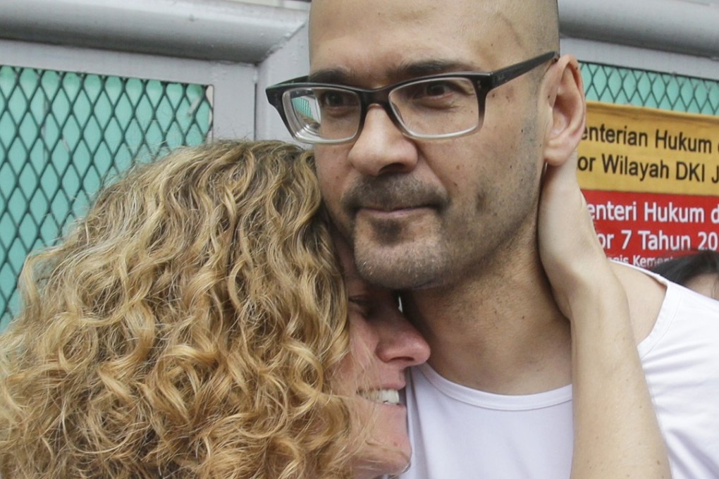 In this August 14, 2015 file photo, Canadian teacher Neil Bantleman hugs his wife Tracy after he was released from Cipinang prison in Jakarta, Indonesia. He is now back in custody. Photo: AP