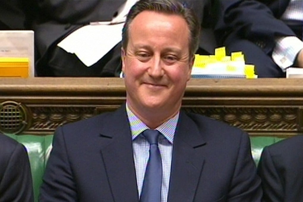 In this video grab, Britain's Prime Minister David Cameron smiles as he listens to Labour party leader Jeremy Corbyn during Prime Minister's Questions in the House of Commons this month. Photo: Reuters