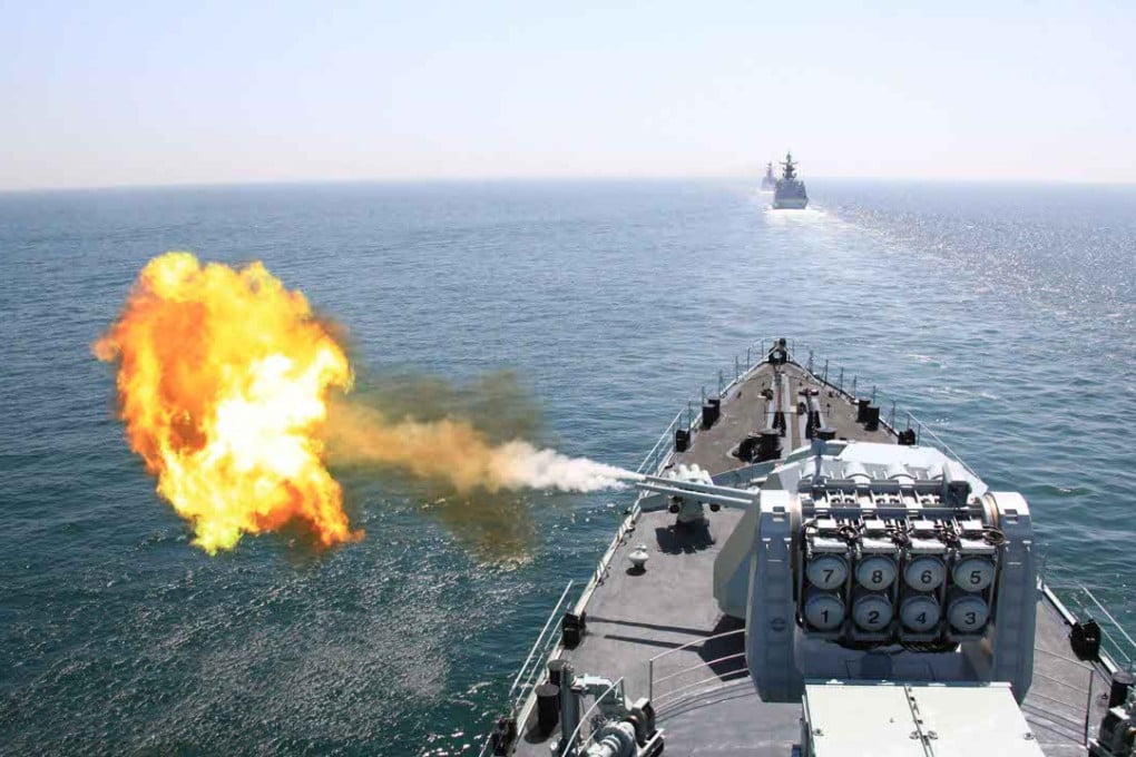 A Chinese navy missile destroyer fires a shell during naval exercises in the Yellow Sea. Photo: Xinhua