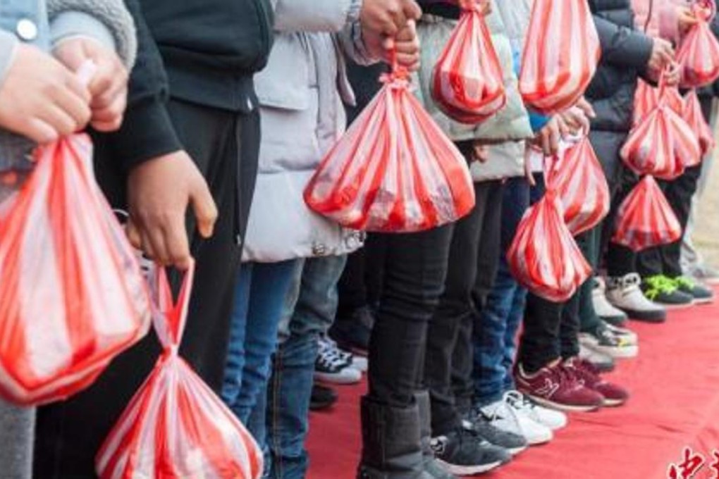 Children have been presented with pork for the past three years as the prize for scoring the best marks in exams at a middle school in Zhejiang province. Photo: Chinanews.com