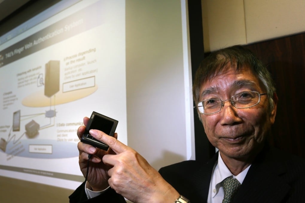 T4U president Osamu Nakahashi with the company's technology for a finger vein authentication system. Photo: Jonathan Wong