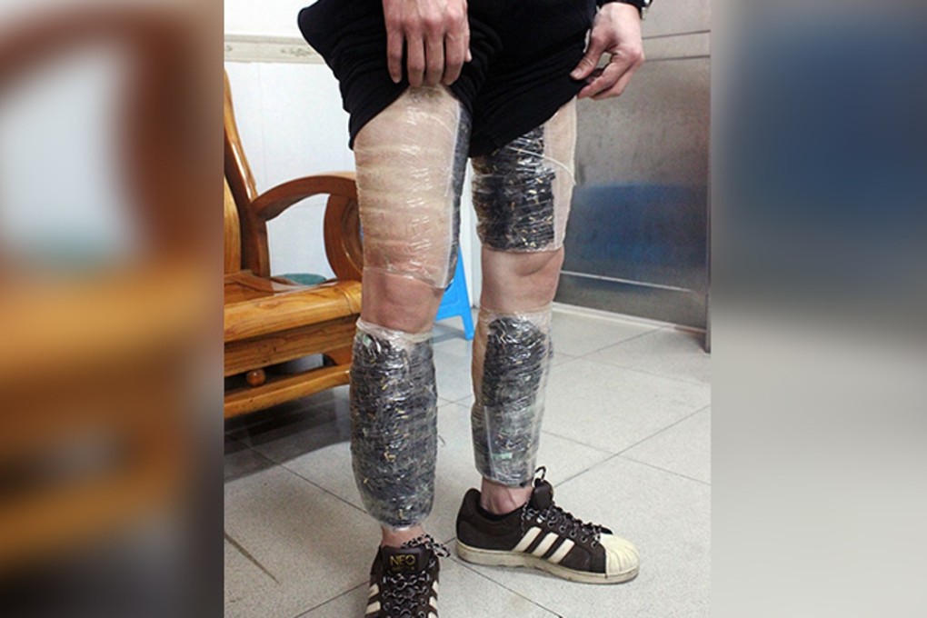 Unsuccessful bid to stay a step ahead of the law. The suspect shows his ‘leggings’ of phone memory cards. Photo: CCTV