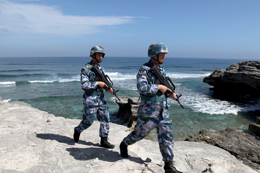 Soldiers of China's People's Liberation Army (PLA) Navy patrol on Woody Island, in the Paracel Archipelago, which is known in China as Xisha Islands, January 29, 2016 Photo: Reuters