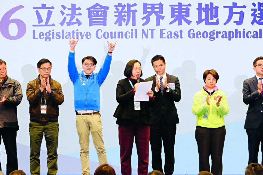 Edward Leung Tin-kei of Hong Kong Indigenous waves to the crowd as the result is announced. Photo: Dickson Lee