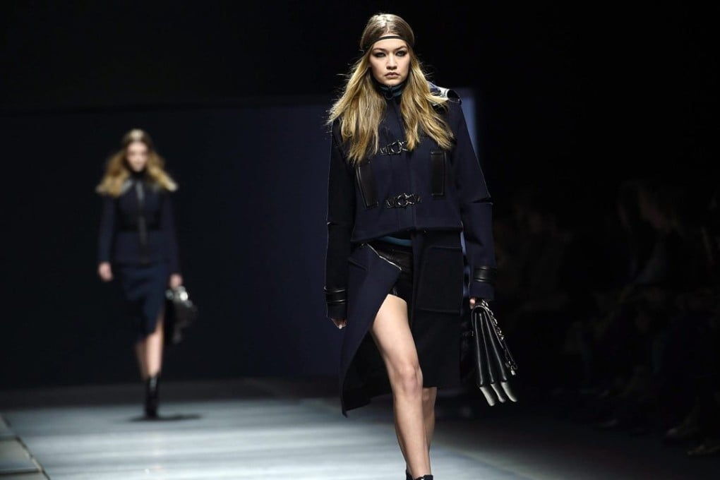 Gigi Hadid wears a look from Versace’s autumn-winter 2016/2017 women’s collection at Milan Fashion Week. Photo: EPA