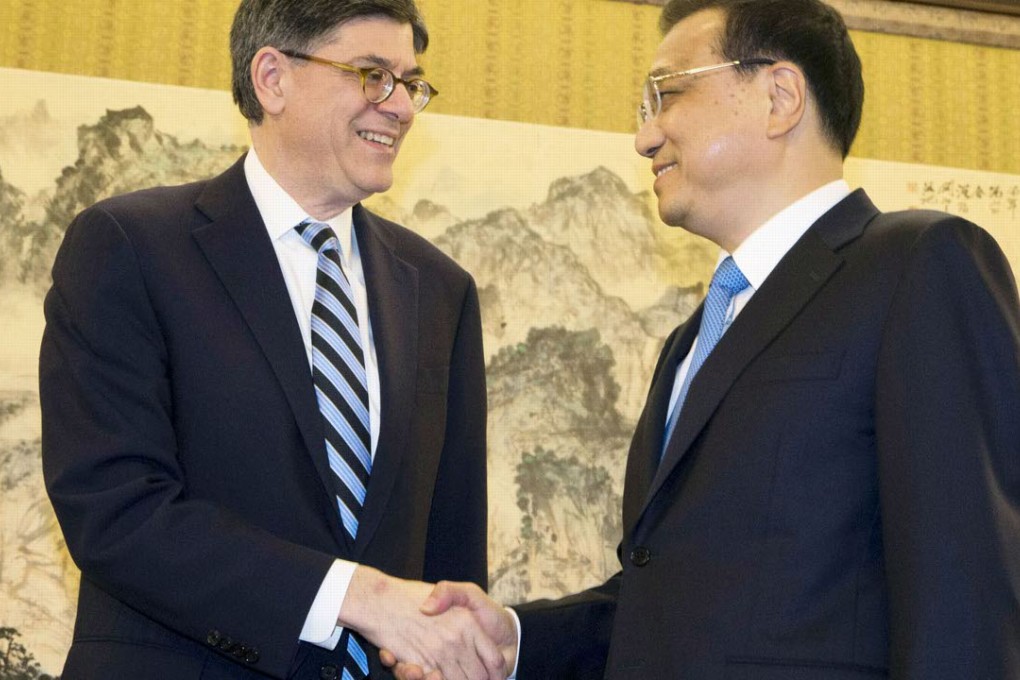 Premier Li Keqiang (right) shakes hands with US Treasury Secretary Jack Lew in Beijing on Monday. Photo: Kyodo