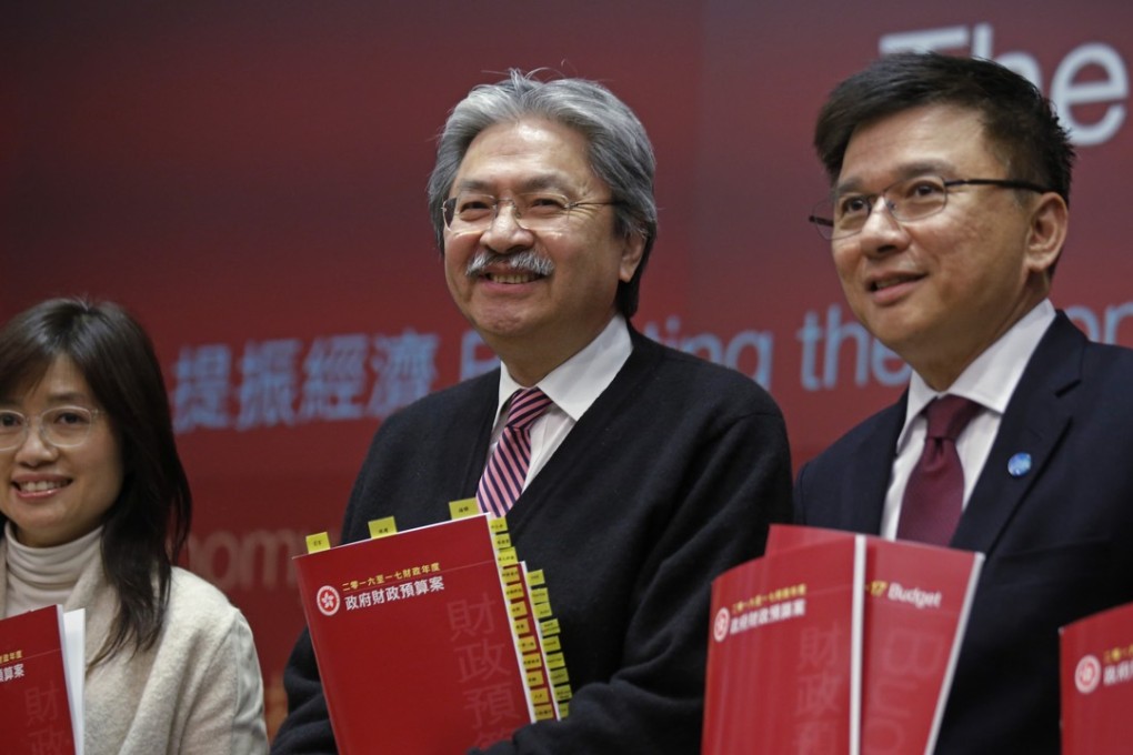 Hong Kong Financial Secretary John Tsang, centre, with Permanent Secretary for Financial Services and the Treasury Elizabeth Tse, left, and Secretary for Financial Services and the Treasury Professor K C Chan, right, at the launch of the budget last week. Photo: AP
