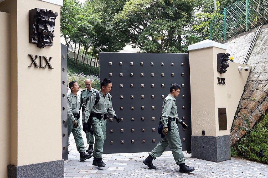Police at HSBC Asia-Pacific chief Peter Wong Tung-shun's luxury home on The Peak. Photo: Dickson Lee