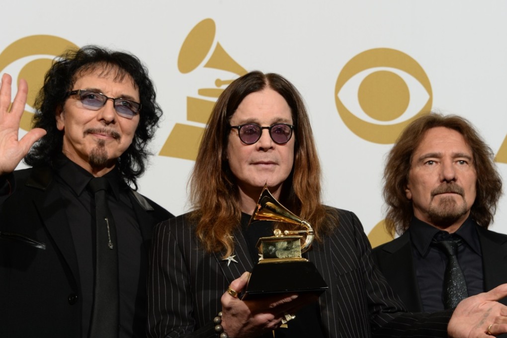Tony Iommi (left), Ozzy Osbourne and Geezer Butler, three of the four original members of Black Sabbath, at the Grammys in 2014. Photo: AFP