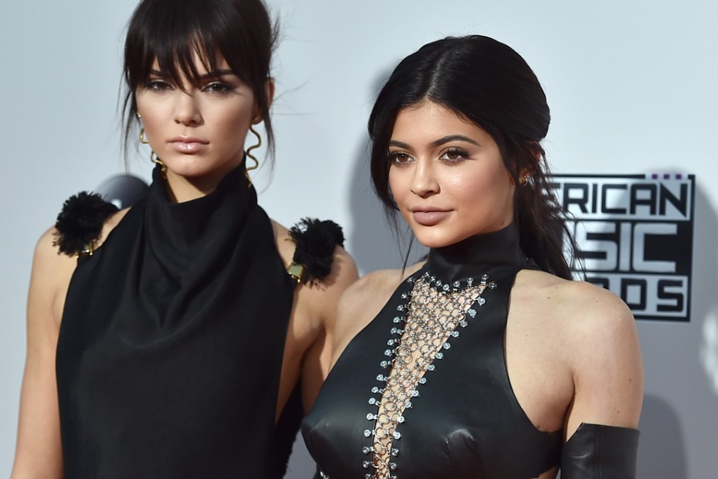 Kylie Jenner, right, pictured with sister Kendall at the American Music Awards at the Microsoft Theatre in Los Angeles last year. Kylie Jenner’s achievements have been mocked by Kylie Minogue’s legal team as “photographic exhibitionism and controversial posts” on social media. Photo: AP