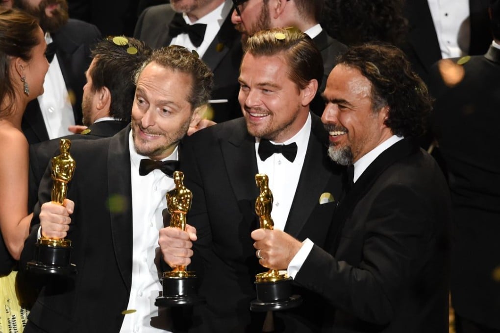 From left: cinematographer Emmanuel Lubezki, actor Leonardo DiCaprio and director Alejandro Gonzalez Inarritu with their Oscars for The Revenant. Photo: Kevin Winter/Getty Images/AFP