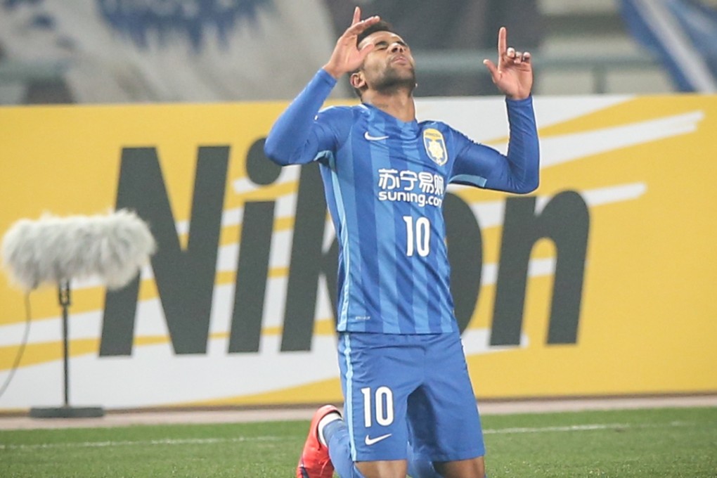 Alex Teixeira celebrates his goal. Photo: Xinhua