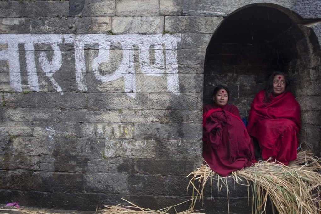 Menstruating Hindu women are kept separate from other devotees at the Madhav Narayan festival at the Bagmati river in Kathmandu, Nepal. Photo: EPA