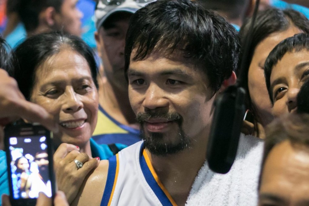 Manny “Pacman” Pacquiao (centre) is hoping to secure a Senate seat in the Phlippines is a celebrity. Photo: EPA