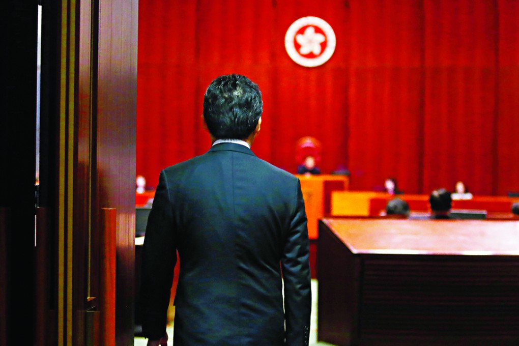 Commerce minister Greg So enters the Legco chamber for the long-running debate on the copyright bill. Photo: Sam Tsang