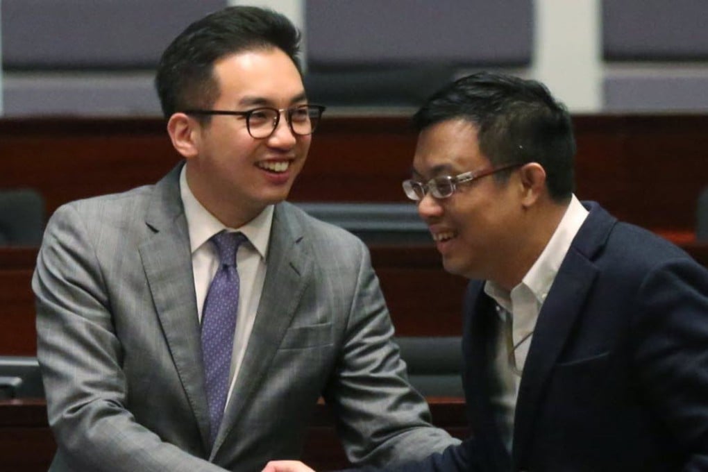 Newly elected Legislative Council member Alvin Yeung Ngok-Kiu shake hands with Legislative Council member James To Kun-sun before a swearing-in ceremony at Legco Chamber in Tamar. Photo: SCMP