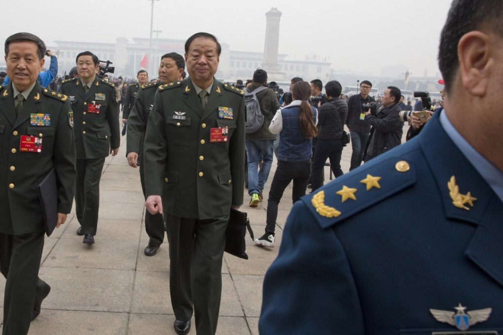 Chinese military officers arrive for the opening session of the Chinese People's Political Consultative Conference at Beijing's Great Hall of the People on Thursday. “Training, computers ... all need money,” said Lieutenant General Wang Hongguang. Photo: AP