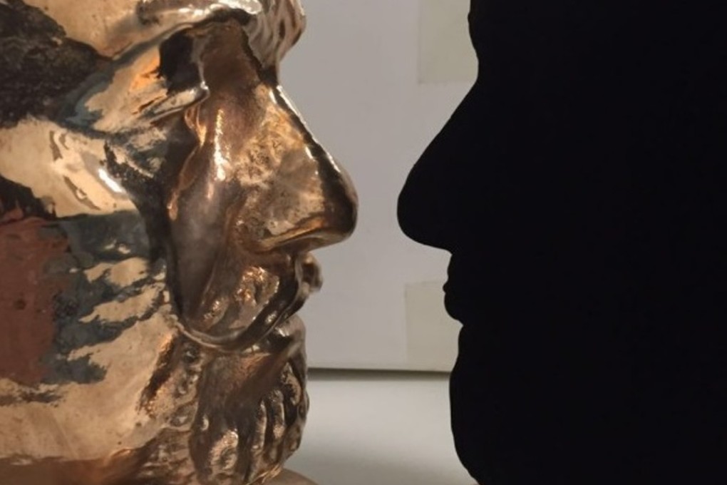 Two bronze sculptures, one in bare bronze and the other coated inVantablack, face off at Britain's Science Museum. Photo: ScienceMuseum
